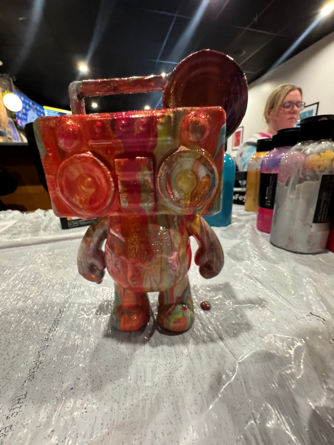 Finished red custom Drip Bear displayed after a Boom Bear creative paint party