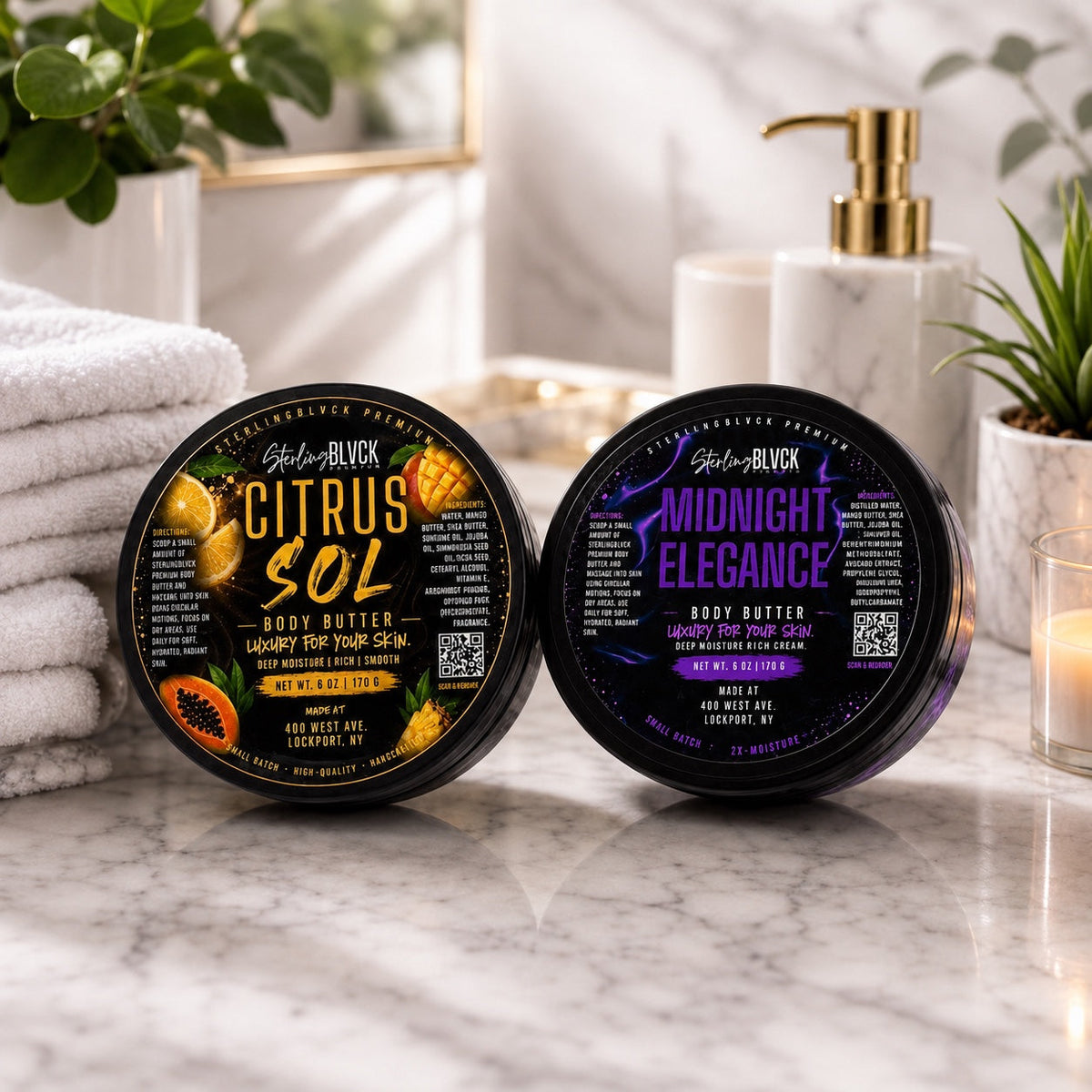 SterlingBLVCK Premium Citrus Sol and Midnight Elegance Body Butter displayed together in a bright bathroom setting.