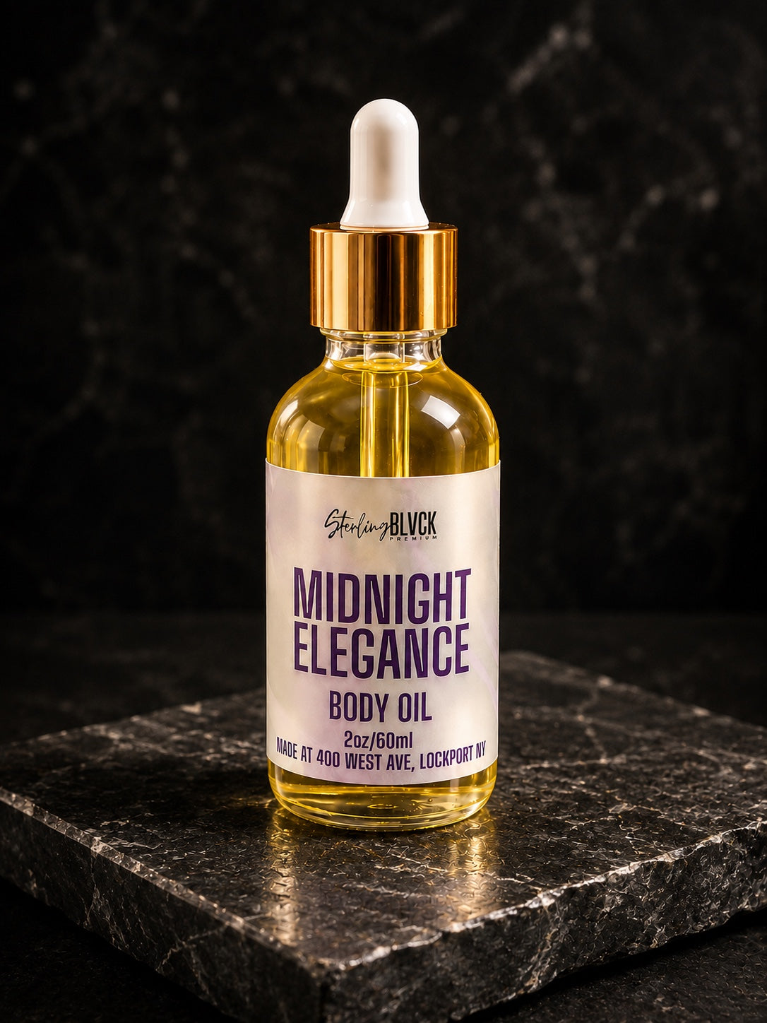 SterlingBLVCK Premium Midnight Elegance Body Oil on black granite slab